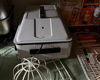 Food warmer and baseball cap holder.