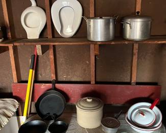 Wagoner frying pans, vintage butter crock w/ lid, enamelware, soup pots w/ lids and antique bed pans.