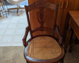 1 of three matching Eastlake chairs with canned seats.