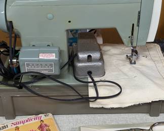 Working Sears/Kenmore electric sewing machine and accessories.