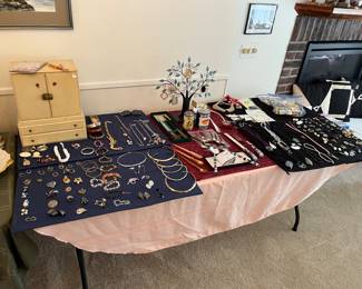 Large selection of jewelry and vintage jewelry box.