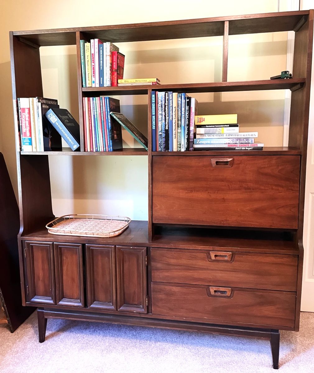Mid-century Modern bookshelf, hardwood, with cabinets and drawers; rattan tray, books