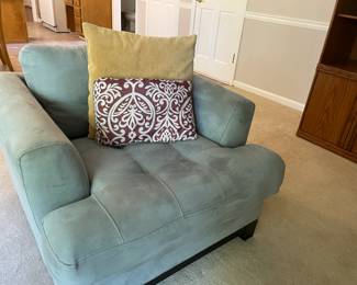 pale green armchair with throw pillows, living room set