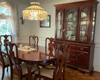 Cherry dining room set with six chairs, matching china cabinet and sideboard.