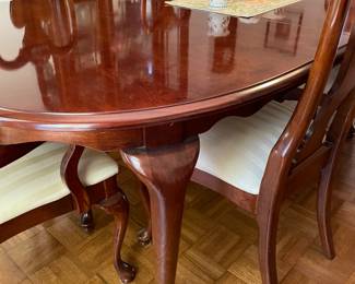 Cherry dining room set with six chairs, matching china cabinet and sideboard.