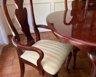 Cherry dining room set with six chairs, matching china cabinet and sideboard.