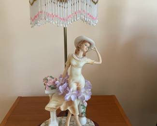 antique milk glass lantern with woman and beaded fringe.