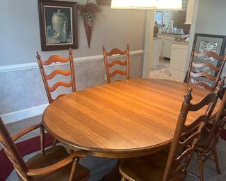 Tell City dining table, has extra leaves and chairs 
