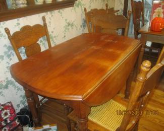 another dining drop leaf table with 4 chairs