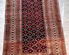 DONLAR917 Antique Area Rug Hand knotted geometric patterned antique area rug, in deep blue, plum with a touch of orange with ivory fringe. &nbsp;Some missing tassels on fringe&nbsp;
