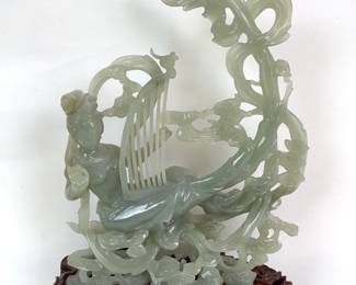 GRLE210 Vintage Chinese Jadeite Lady With Harp Lady with a Harp sitting on flowers. Has a little discoloration on one side of the lady. Comes in 2 pieces.
