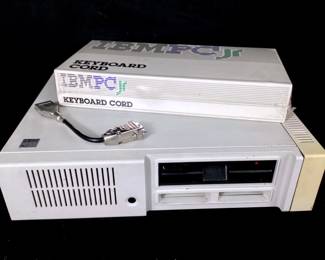 GRLE906 IBM PC Jr 4860 Computer New In Box Keyboard Cord Retro 1980's IBM Jr model no. 4860 desktop computer with new in box keyboard cord and additional cord/adapter. &nbsp;Untested.
