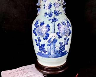 GRLE905 Antique Ching Dynasty Vase With Certificate Of Antiquity Strong neck, deep saucer shaped top accentuate the full melon shape of this vase with lion handles. Detailed cobalt blue brushwork depicting a garden scene with giant flowers and bamboo on a celadon and blue underlay. &nbsp;Ch'ing Dynasty 'Tao Kuantan 1821-1850. &nbsp;Certificate of antiquity dates this piece circa 1850.&nbsp;
