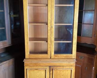 JIFI106 Antique Two Piece Pie Cabinet Rustic tall cabinet, 2pc, on wheels. Original old wavy glass, original locking mechanisms, in doors. Square & round nails. Measures approximately 81 inch tall, 15 inch deep, 35.5 inch wide. No keyS.
