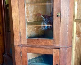 JIFI108 Aged Antique Corner Cabinet Rustic, corner cupboard with original glass, in doors. Square nails. Looks to have a repair on one of the back panels.&nbsp;
