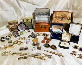 RIHI100 Large Lot, Assortment Vintage Mens Accessories Collection of items from several small boxes, of men's items. Two Boy Scout compasses, working stop watch. Eight wheat Pennie's, Camel lighter, two Microsoft, pin backs, many sets of cuff links & tie pins In blue jewelry box is two silver colored rings with blue center stones. No hallmarks on either. Also included, is two pair of red tipped, (RP on Sliver) cuffs and one cobalt blue set with no markings.&nbsp;
