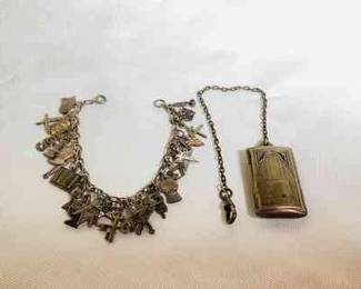 RIHI102 Vtg Antique Sterling Charm Bracelet, Watch Fob 1950's sterling charm bracelet with 25 charms, at least 17 stamped sterling. Measure approximately 7 inches long. Also included is an Art Deco, sterling watch clip, fob.&nbsp;Weighs approximately 38 grams
