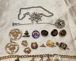 RIHI101 Gold Anniversary Pin Backs, Markers, Charms More Two round, gold plated, Illinois Bell anniversary pieces, pin & pendant. Three add'l small Bell's, two, pins (one stamped 10k) & one charm, also stamped 10k. Charm bracelet also has one 9kt charm, in the shape of Australia (we think) Three Lockheed tie pins, one (5 yr) is 10k gold filled, 10 yr, is stamped 10k & appears to have small diamond. 25 yr pin, also stamped 10k with what appears to be five small diamonds.&nbsp;
