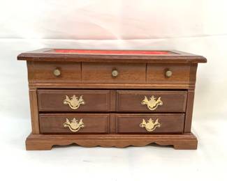 RIHI201 Jewelry Box With Costume Jewelry Wooden jewelry box with a bunch of different kinds of costume jewelry. Jewelry box itself does have some wear to it.
