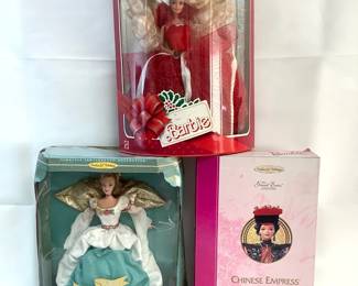 RIHI203 Barbie Collectable Dolls From the Timeless Sentiments Collection is the Angel of Joy Barbie. Has the original box which does have some damage but doesn't effectively the doll at all. Also from the Great Eras Collection is the Chinese Empress. Has the original box and looks to be in good condition. Next is from the Happy Holidays Collection Special Edition 1988 Barbie. Comes with the original box and in good condition.
