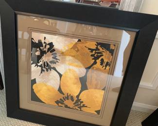 there are 2 framed similar prints