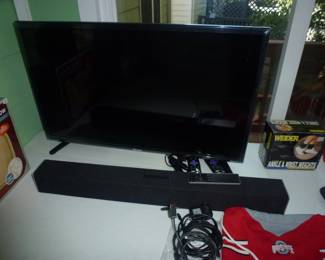 FLATSCREEN TV AND SOUND BAR