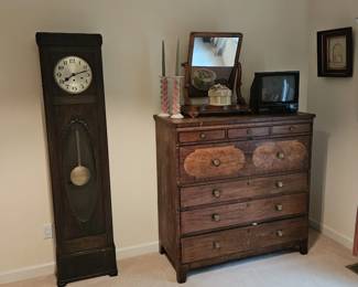 Grandfather clock ($150), inlaid chest ($250)