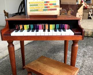 Vintage Jaymar 15 Key Toy Piano with Color Strip and coordinating Sheet Music; needs cleaning, missing black keys, bench is in 2 pieces, sheet music is fragile but it is still here (can be glued back together)