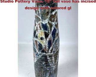Lot 1808 Mid Century Glazed Earthenware Studio Pottery Vase. 16 tall vase has incised design with colored gl