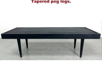 Lot 1908 Ebonized Modernist Slat Bench. Tapered peg legs. 