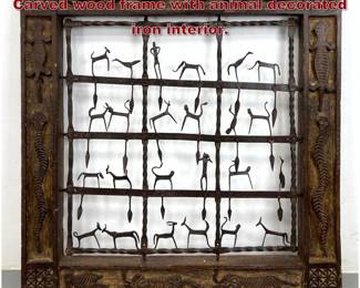 Lot 1915 Ethnographic Panel Wall Hanging. Carved wood frame with animal decorated iron interior. 