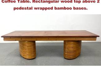 Lot 1925 PAUL FRANKL style Bamboo Coffee Table. Rectangular wood top above 2 pedestal wrapped bamboo bases. 