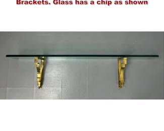 Lot 2168 Modern Glass Wall Shelf. Pr Brass Brackets. Glass has a chip as shown 