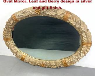 Lot 2167 Very Large Decorator Carved Wood Oval Mirror. Leaf and Berry design in silver and gilt finish. 