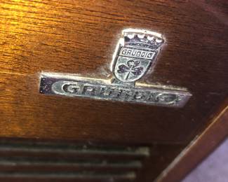 SIGNATURE LOGO OF OUR GRUNDIG STEREO COUNSEL STEREO RECORD PLAYER THAT WORKS GREAT.