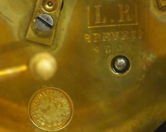 CLOSE UP VIEW OF THIS MUSUEM QUALITY BRONZE MANURFACTURING FRENCH 19TH CENTURY CLOCK MUSEUM QUALITY VINCENTI et Cie PARIS BRONZE FRENCH MANUFACTURING SIGNED CLOCK GARNITURE CANDLEOBRA 3 PIECE SET - 19TH CENTURY. JEAN VINCENTI IS THOUGHT TO HAVE BEEN A CORSICAN WHO STARTED HIS FACTORY IN MONTBELIARD, FRANCE IN 1823. HE USED MACHINES HE HAD INVENTED TO PRODUCE "ROULANTS" (MOVEMENTS) FOR CLOCKS & WATCHES. HIS BUSINESS GREW & BY 1855 THE COMPANY HAD SIGNIFICANT SUCCESS AND WON SEVERAL AWARDSAT PARIS EXHIBITIONS.