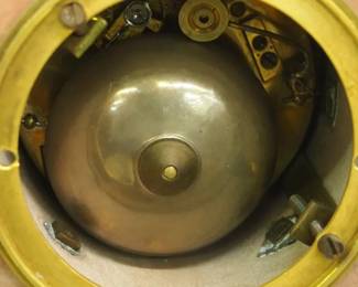 CLOSE UP VIEW OF THIS BRONZE 19TH CENTURY FRENCH CLOCK MECHANICAL BELL MECHANISM 19TH CENTURY. MUSEUM QUALITY VINCENTI et Cie PARIS BRONZE FRENCH MANUFACTURING SIGNED CLOCK GARNITURE CANDLEOBRA 3 PIECE SET - 19TH CENTURY. JEAN VINCENTI IS THOUGHT TO HAVE BEEN A CORSICAN WHO STARTED HIS FACTORY IN MONTBELIARD, FRANCE IN 1823. HE USED MACHINES HE HAD INVENTED TO PRODUCE "ROULANTS" (MOVEMENTS) FOR CLOCKS & WATCHES. HIS BUSINESS GREW & BY 1855 THE COMPANY HAD SIGNIFICANT SUCCESS AND WON SEVERAL AWARDSAT PARIS EXHIBITIONS.