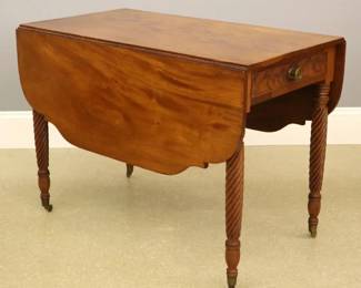 CORNER VIEW OF AMERICAN FEDERAL PERIOD MAHOGANY PEMBROOK DROPLEAF TABLE WITH CARVED ROPE LEGS, ORIGINAL CASTER WHEELS CIRCA 1820-1840