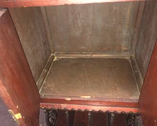 INSIDE VIEW OF AN AMERICAN CARVED MUSIC CABINET FROM THE LAWRENCE FISHER LENOX AVENUE MANSION DETROIT - FROM THE MUSIC ROOM - ORNATE SCROLL CARVINGS, SIDE STORAGE BELOW, FOR BOOKS & RECORDS, ORIGINAL OLD DARK FINISH.