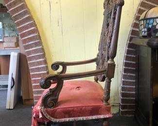 SIDE VIEW OF THE ORIGINAL SIDE VIEW OF A HIGHLY CARVED AMERICAN ROCOCO LAWRENCE FISHER LENOX AVENUE DETROIT RESIDENCE. THIS IS THE ORIGINAL CHAIR IN OUR PHOTOGRAPH OF MOTHER MRS. FISHER SEATED WITH HER SEVEN (7) FISHER SONS TAKEN AT LAWRENCE FISHER'S RESIDENCE CIRCA 1931.