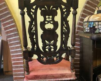 CLOSE UP VIEW OF HIGHLY CARVED BACKSIDE VIEW OF A HIGHLY CARVED AMERICAN ROCOCO LAWRENCE FISHER LENOX AVENUE DETROIT RESIDENCE. THIS IS THE ORIGINAL CHAIR IN OUR PHOTOGRAPH OF MOTHER MRS. FISHER SEATED WITH HER SEVEN (7) FISHER SONS TAKEN AT LAWRENCE FISHER'S RESIDENCE CIRCA 1931.