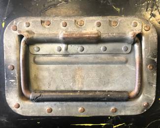 ORIGINAL METAL SIDE HANDLE VIEW OF THE ORIGINAL RARE EARTH BAND TRAVEL CONCERT TRUNKS CIRCA 1970'S