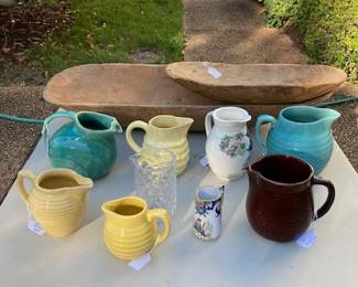 Dough bowls and a collection of pitchers