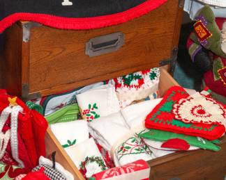 A campaign style bedside table under all the Christmas items