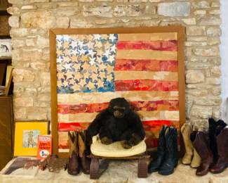 large flag collage by Geraldine, camel saddle ottoman, Texas cowboy boots for him and her