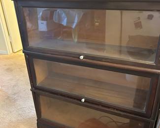 Barrister Bookcase, has Brass trim on side, Ceramic knobs, Glass in excellent condition  $ 850.00