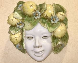 Pottery face w/ lemon headpiece wall hanging