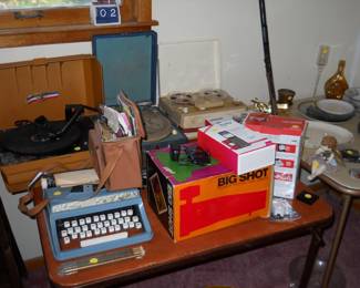 portable Sear typewriter. portable phonographs, tape recorder, poloriad camera