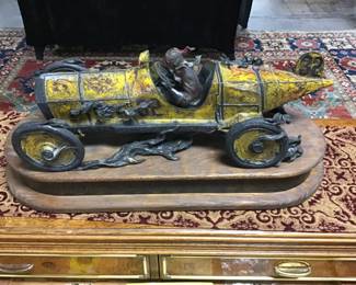 MARMON WASP, by Stanley Wanless. Bronze sculpture of the first car to win the Indianapolis 500 in 1911. The design of this vehicle introduced the invention of the first rearview mirror to the world. Only 40 of these were made.