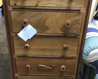 Designed and handcrafted by Will Armstrong from Oak and Nebraska Walnut. Each knob, each piece of trim work, the hand carved whale near the bottom of the chest were all carved by Will. They will never be another piece like this. Like Will, it is unique in every way.